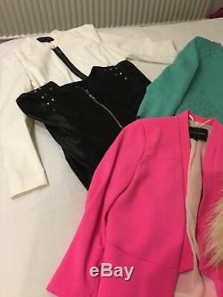 A total of 57 items. Womens clothes size 8/10 and shoes/boots size 4 for sale